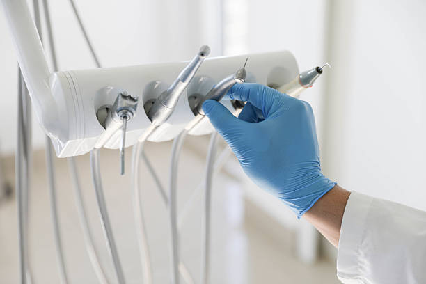 Professional Tooth Extraction technician working in Lake Delta, NY